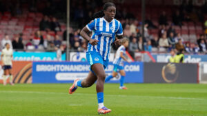 Brighton WSL defeat: A Brighton & Hove Albion Women player running on the pitch during a match.