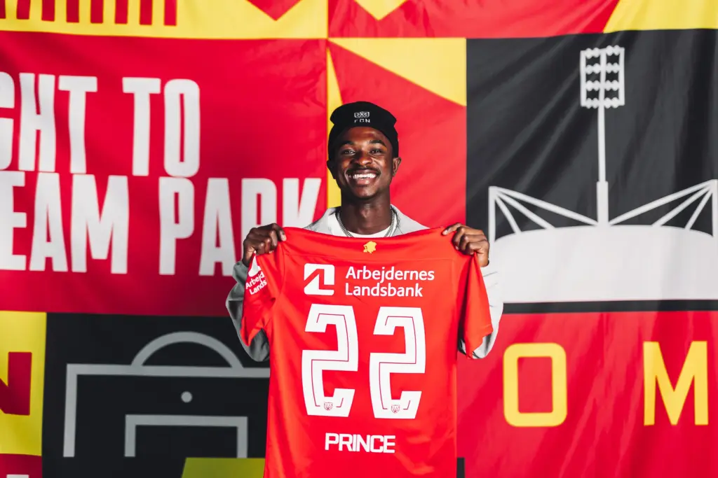 Prince Amoako Junior holding a FC Nordsjaelland shirt amid Brighton transfer interest
