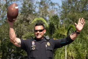 December 5, 2022, Tampa, Florida, USA: Tampa Police Department Lt. Ben Brown celebrates after Silvio, a male Tamandua, predicted that Tampa Police would win the Badge Bowl against Tampa Fire Rescue at ZooTampa at Lowry Park on Monday, Dec. 5, 2022, i
