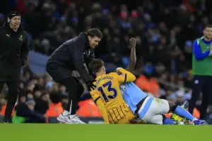 Fabian Hurzeler the Brighton & Hove Albion manager helps Jack Hinshelwood (13) of Brighton & Hove Albion get to his feet during the Premier League match between Manchester City and Brighton and Hove Albion at the Etihad Stadium, Manchester, U